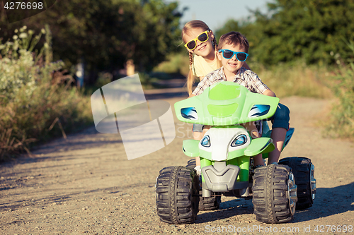 Image of Happy children playing on the road at the day time.