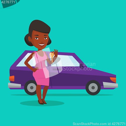 Image of Woman holding keys to her new car.