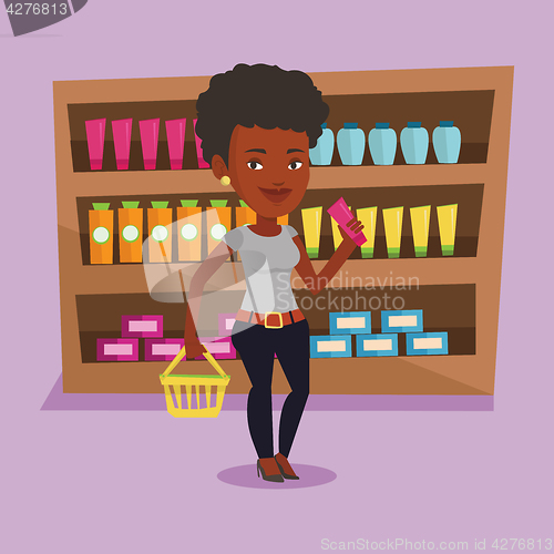 Image of Customer with shopping basket and tube of cream.