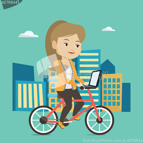 Image of Woman riding bicycle in the city.