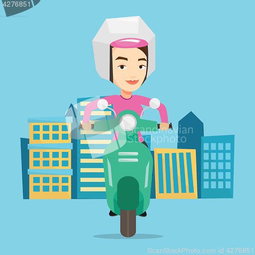 Image of Woman riding scooter in the city.