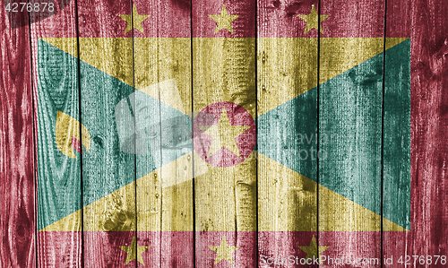 Image of Flag of Grenada on weathered wood