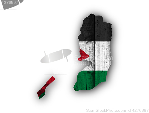 Image of Map and flag of Palestine on weathered wood