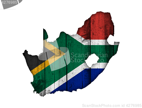 Image of Map and flag of South Africa on weathered wood