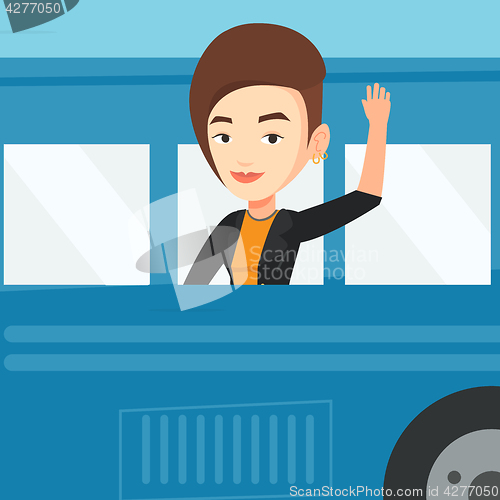 Image of Woman waving hand from bus window.