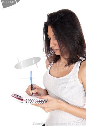 Image of Woman talking nots.