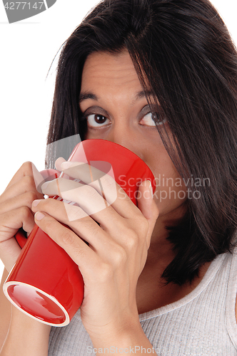 Image of Beautiful Hispanic woman with red mug.