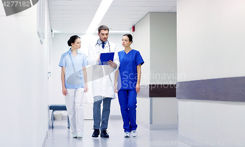 Image of group of medics at hospital with clipboard