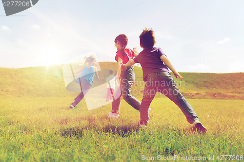 Image of group of happy kids running outdoors