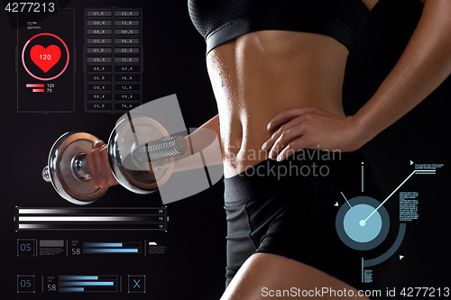 Image of close up of sporty woman exercising with dumbbell
