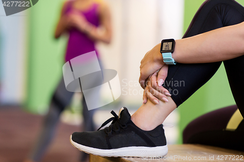 Image of close up of woman with heart rate tracker in gym