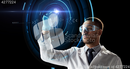 Image of scientist with test tube and virtual projection