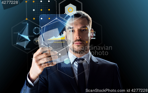 Image of businessman working with transparent tablet pc