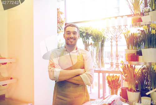 Image of florist man or seller at flower shop counter