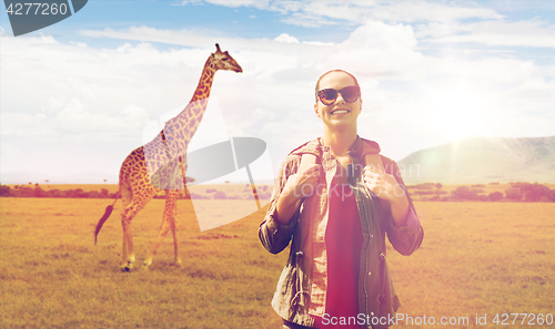 Image of happy woman with backpack traveling in africa