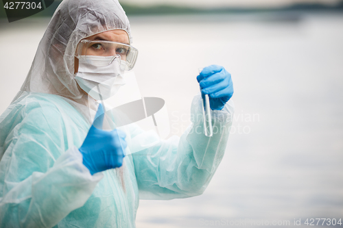 Image of Photo of ecologist in mask