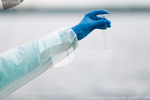 Image of Photo of hand with test-tube