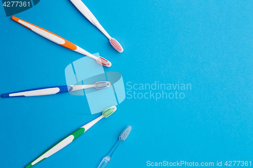 Image of Colorful toothbrushes place for inscription