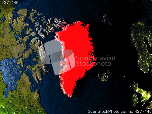 Image of Greenland in red from space at night