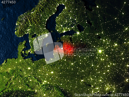 Image of Latvia in red from space at night