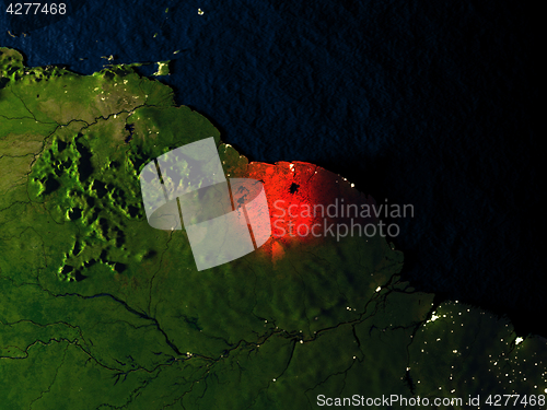 Image of Suriname in red from space at night