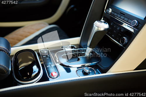 Image of Detail of modern car interior, gear stick.