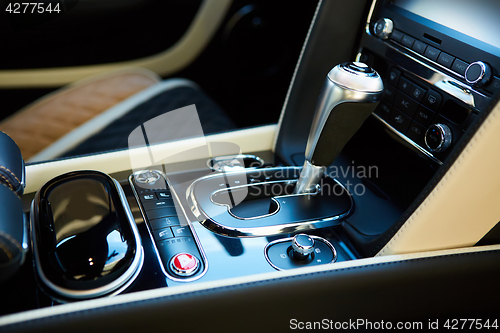 Image of Detail of modern car interior, gear stick.