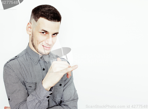 Image of Portrait of a smart serious young man standing against white background. Emotional concept for gesture 