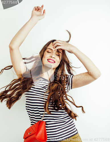 Image of young pretty long hair woman happy smiling isolated on white background, wearing cute tiny fashion handbag, lifestyle people concept 