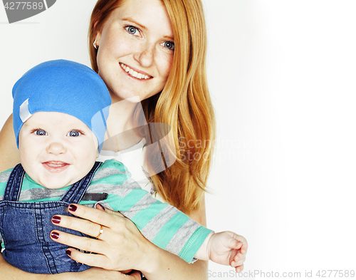 Image of young beauty mother with cute baby, red head happy modern family smiling isolated on white background close up, lifestyle people concept