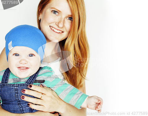 Image of young beauty mother with cute baby, red head happy modern family smiling isolated on white background close up, lifestyle people concept