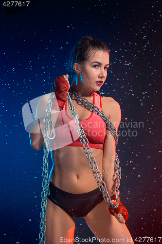 Image of Young tanned fit woman with beautiful sporty buttocks and slim with water drops