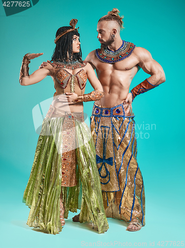 Image of The man, woman in the images of Egyptian Pharaoh and Cleopatra