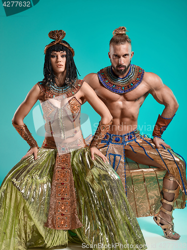 Image of The man, woman in the images of Egyptian Pharaoh and Cleopatra