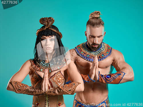 Image of The man, woman in the images of Egyptian Pharaoh and Cleopatra