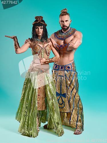 Image of The man, woman in the images of Egyptian Pharaoh and Cleopatra