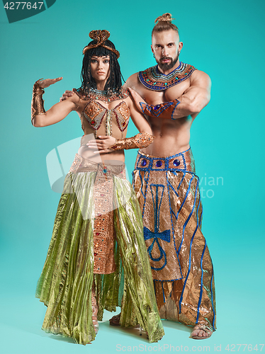 Image of The man, woman in the images of Egyptian Pharaoh and Cleopatra