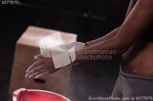 Image of black woman preparing for climbing workout