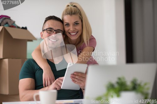 Image of Young couple moving in a new home