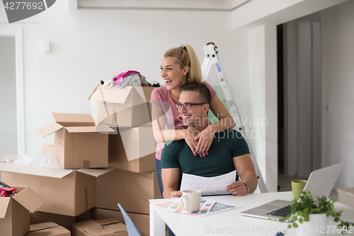 Image of Young couple moving in a new home