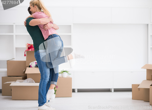 Image of happy Young couple moving in new house