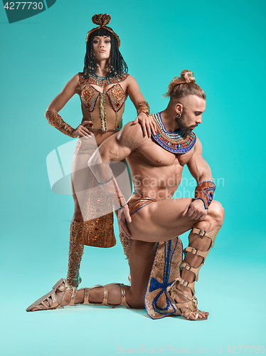 Image of The man, woman in the images of Egyptian Pharaoh and Cleopatra