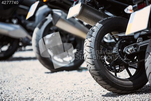 Image of Motorcycle luxury items close-up: headlights, shock absorber, wheel, wing, toning.