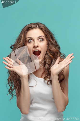 Image of Portrait of young woman with shocked facial expression