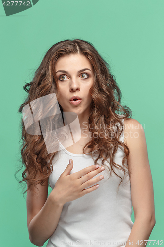 Image of Portrait of young woman with shocked facial expression