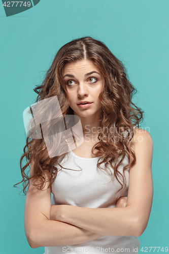 Image of Portrait of young woman with shocked facial expression