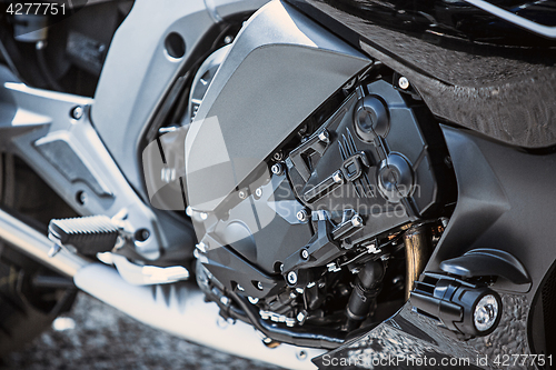 Image of Motorcycle luxury items close-up: headlights, shock absorber, wheel, wing, toning.