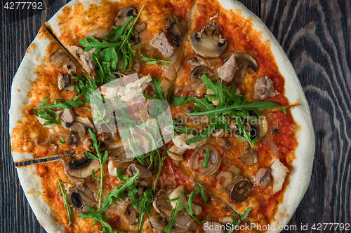 Image of Pizza with chicken and mushrooms