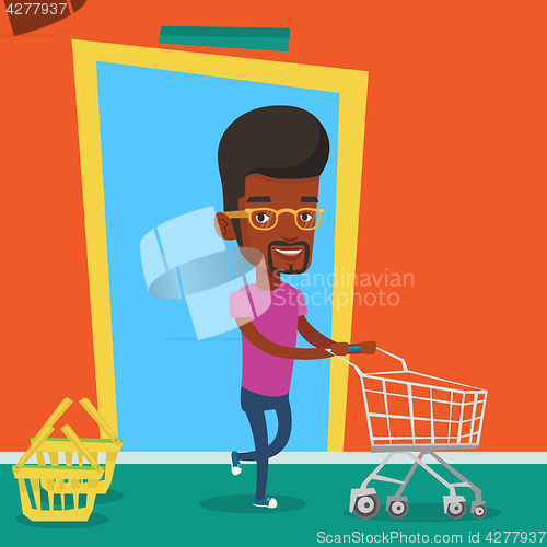 Image of Male customer running into the shop with trolley.