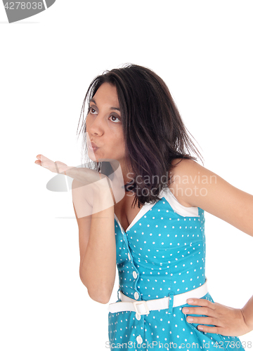 Image of Lovely woman blowing a kiss.